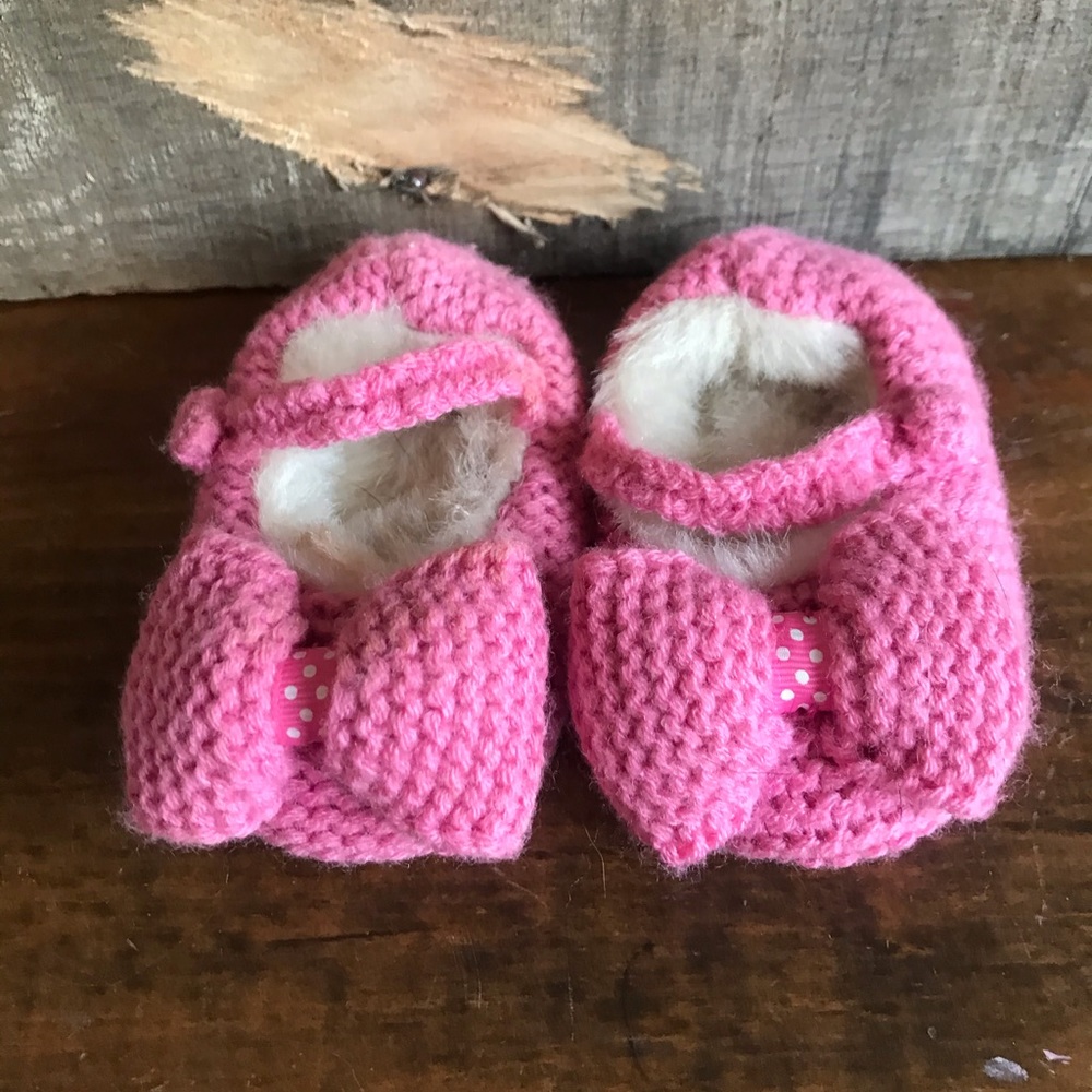 Fuzzy pink knit Monsoon infant slippers with bow